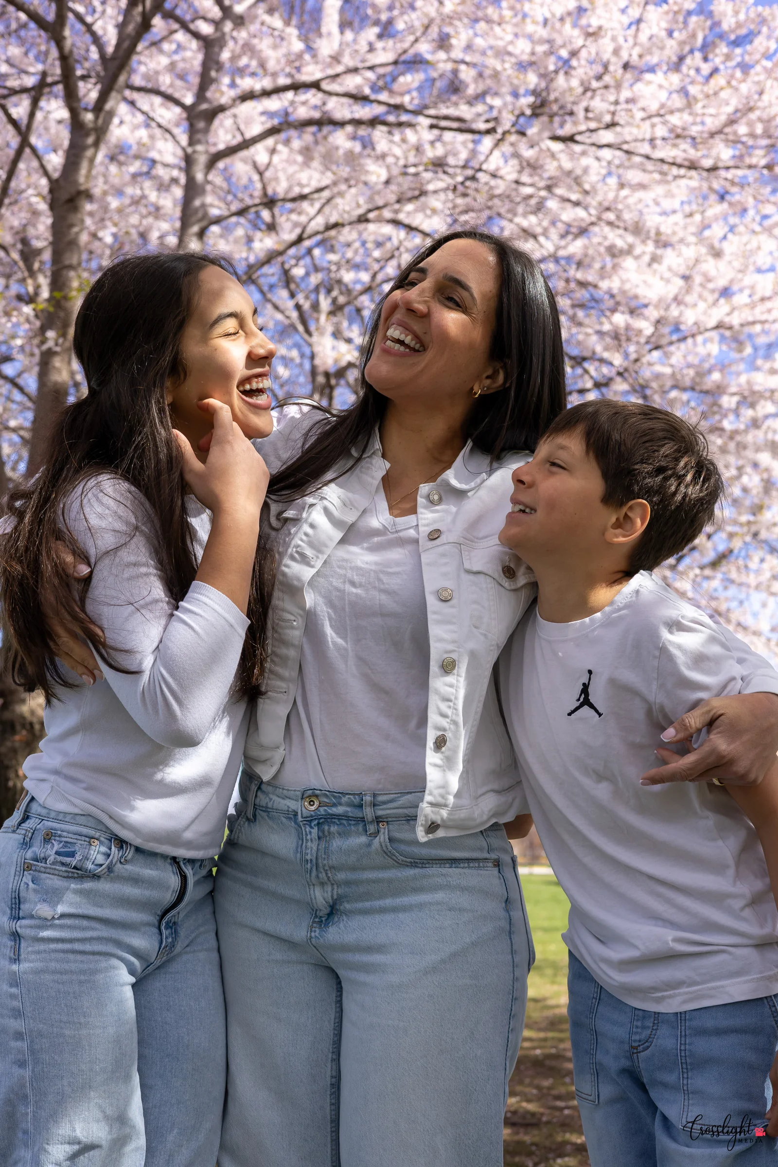 Mother laughing and playing with her children