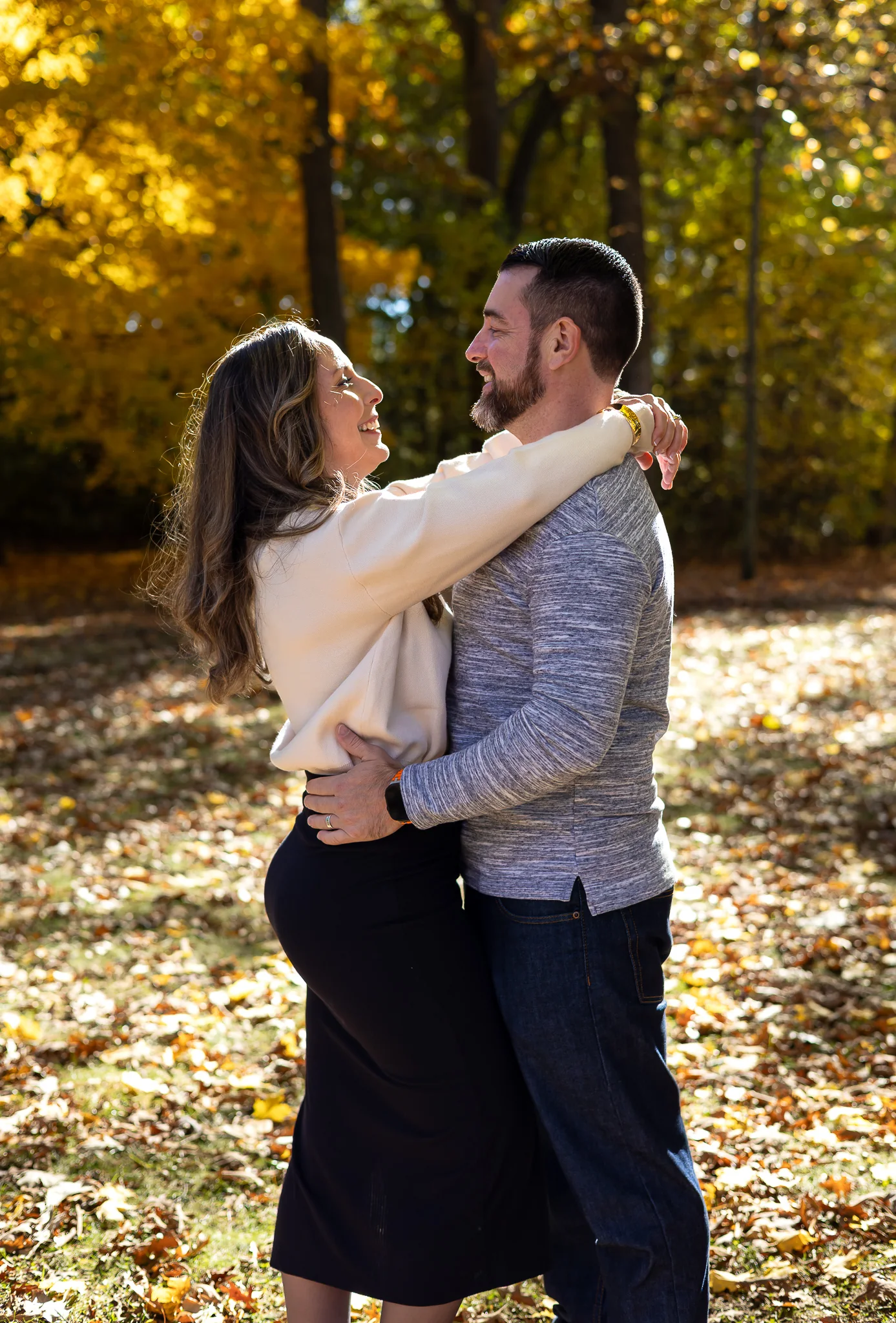 Couple laughing together during an autumn session