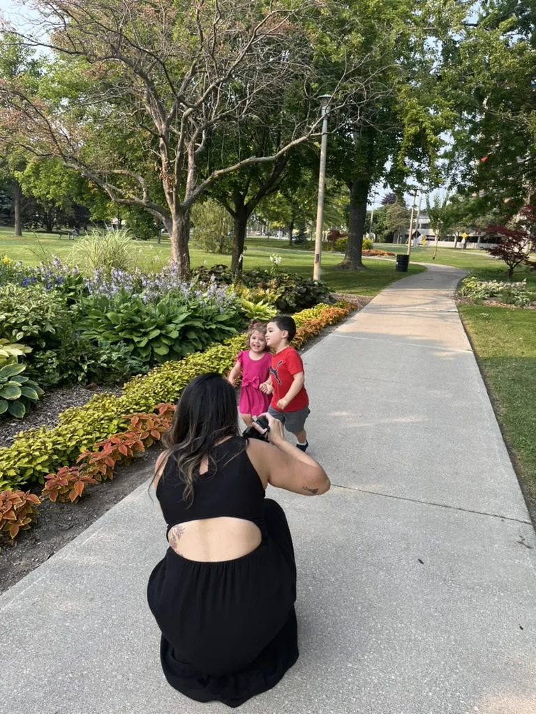 Mahara photographing a family outdoors