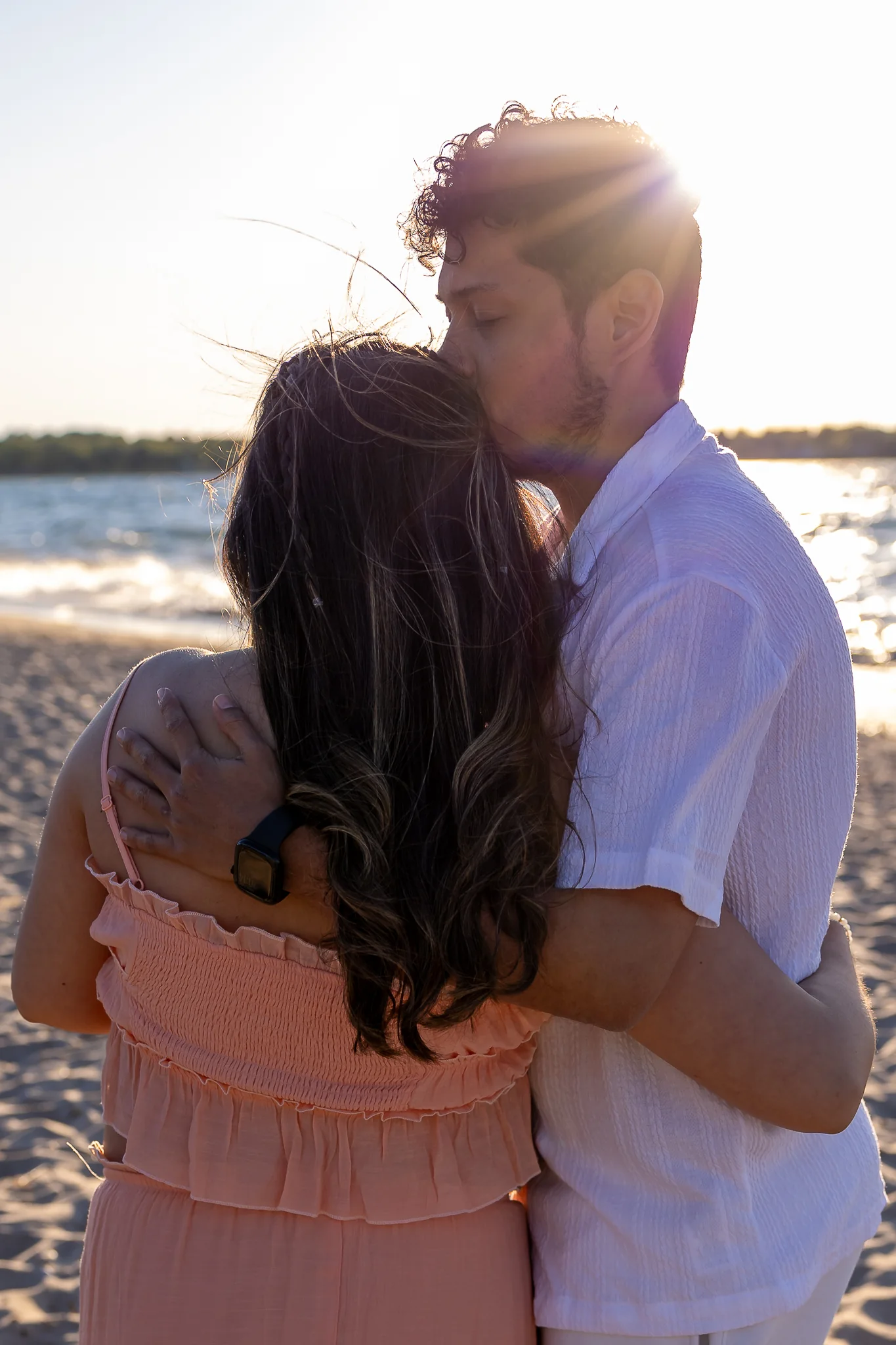 Expecting couple sharing a quiet moment by the water