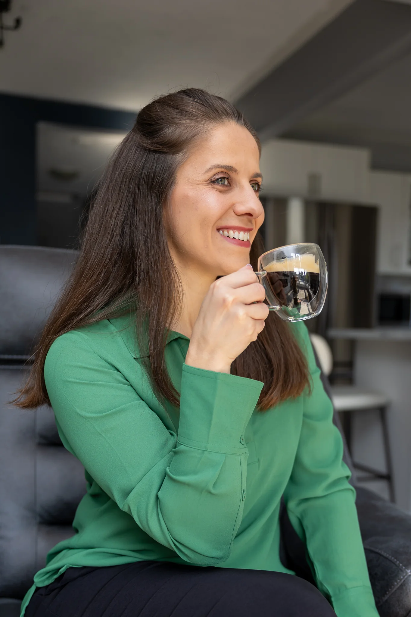 Professional portrait of a businesswoman enjoying coffee